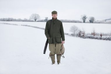 Death in the Afternoon. A dead pheasant and a man with a shotgun with his eyes closed.