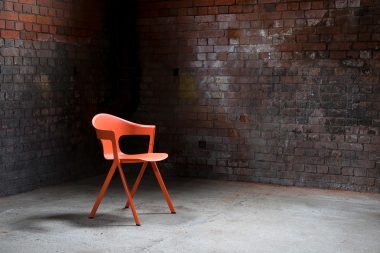 An orange chair photographed in an abandoned power station