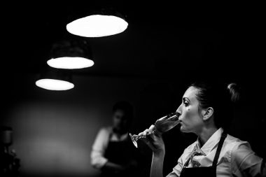 Picture of woman preparing drinks at WastEd food evening in London