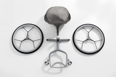 Parts of a wheelchair on a white background in a London photography studio