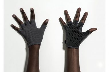 Hands wearing gloves against a white background