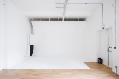 A white infinity cove in a photography studio in London.