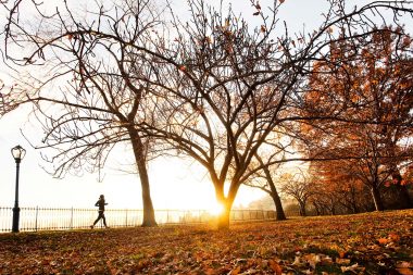 A woman running in Central park New York