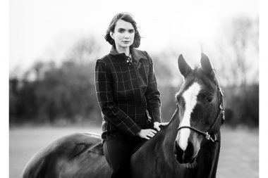 lifestyle photograph of a woman on a horse