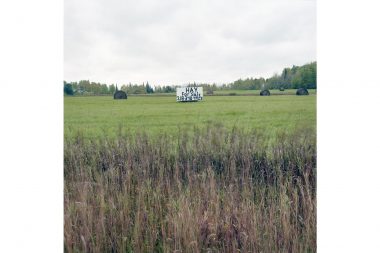 A sign advertising Hay for sale in a field in Minnesota.