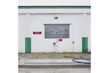 Wall of garage with red and green details in Minnesota.