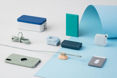 Arrangement of smart phone accessories on paper by Richard Boll