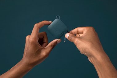Hands holding a nolii mobile phone accessory