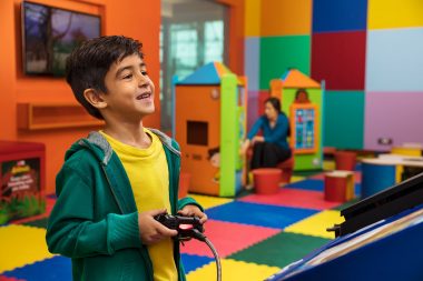 Advertising photograph of boy playing video game