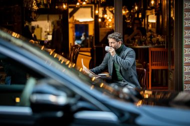 Lifestyle advertising photography of man in cafe with mercedes benz