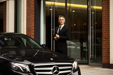 Lifestyle photograph of a chauffeur in london