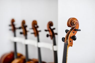 Details of cellos in a white room at j and a beare ltd London