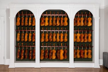 Rows of violins at J & A Beare Ltd by Richard Boll photography