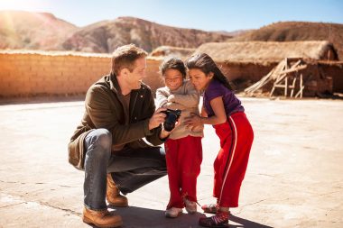 Photographer and children in lifestyle product photograph