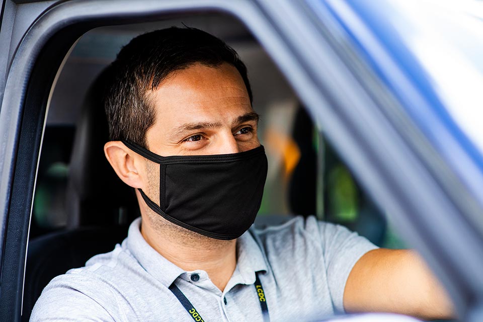 Taxi driver with PPE mask photographed by London-based photographer Richard Boll