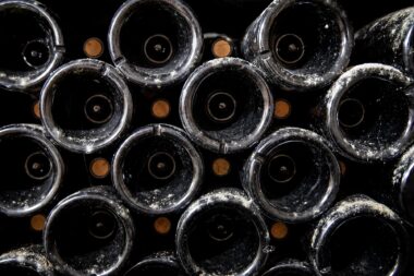 Old wine bottles in the cellar of the olivier bernstein winery in beaune france