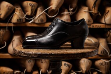 Black womens shoes on a stool photographed by Richard Boll for John Lobb Ltd