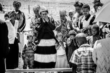 People at a funeral by Richard Boll Photography