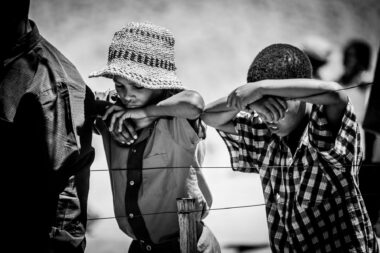 Two boys at a funeral by Richard Boll