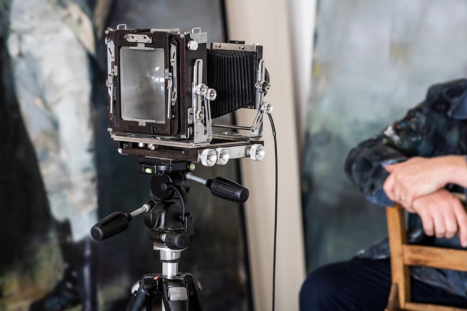 a 5x4 large format camera on a tripod. From film to digital photography by Richard Boll