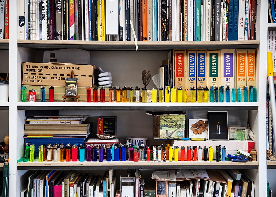 A photograph of collected items on the shelves in the studio of gavin turk