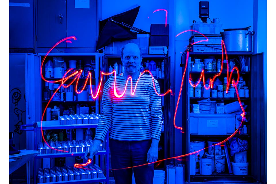 a-photographic-portrait-of-the-british-artist-gavin-turk-with-his-signature-written-in-the-air