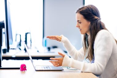 Woman working with a laptop for Octopus Energy