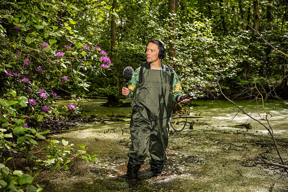 a photographic portrait of the conceptual artist adam chodzko in a pond copyright richard boll