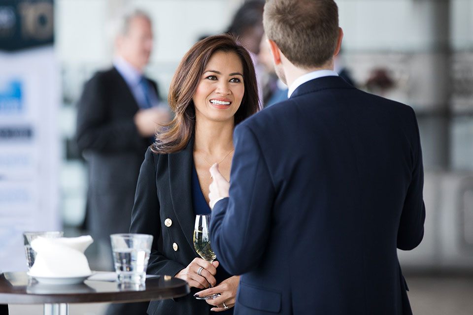 People socialising at a corporate event.