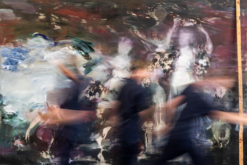 Multiple blurred exposure of the painter Jake Wood-Evans working on a large canvas. Photo by Richard Boll, London.
