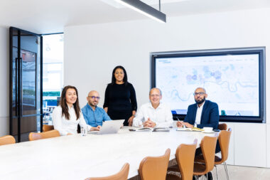 A group of five people in a meeting room photographed for Derwent London.