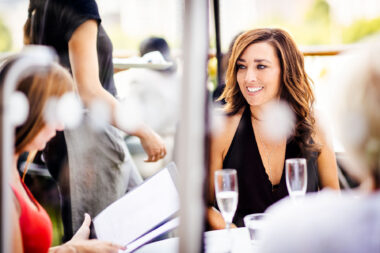 Lifestyle photograph of a woman having a drink at The OXO Tower Restaurant in London