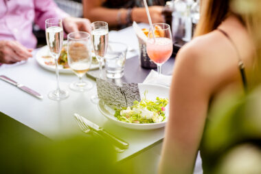 Lifestyle photography of a family dining outside at The OXO Tower Restaurant in London