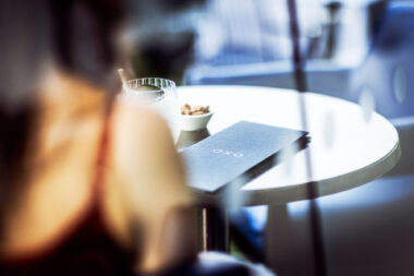 A drinks menu on a table at The OXO Tower Restaurant. Marketing photography by Richard Boll.