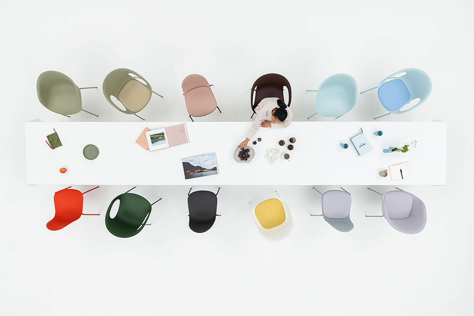 Kin chairs around a table in a studio, photographed for Allermuir by Richard Boll Photography.