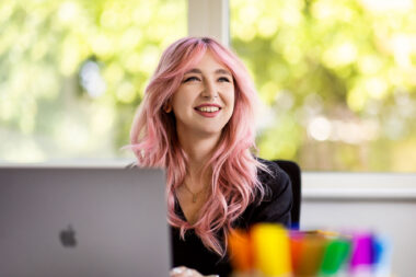 A woman working at a computer in an office in Southampton.