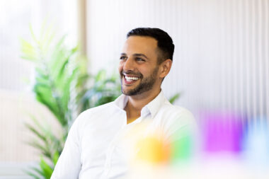 A corporate photograph of a man in a meeting in an office in Southampton.