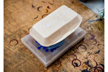 A sculpture of a polystyrene carton with the signature of Gavin Turk.