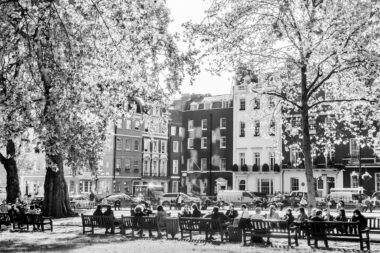 People enjoying their lunch break in Golden Square in London.