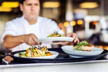 A chef serving up food at the OXO Tower restaurant in London.