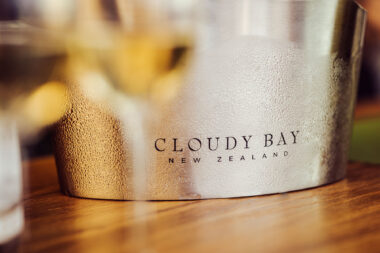 A frosted ice bucket with Cloudy Bay New Zealand branding.