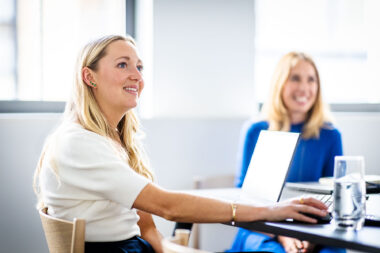 A corporate lifestyle photograph of two women in a meeting in London.