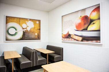 Interior photograph of Holland Park School with commissioned photography on the walls. Nigel Slater Toast inspired images.