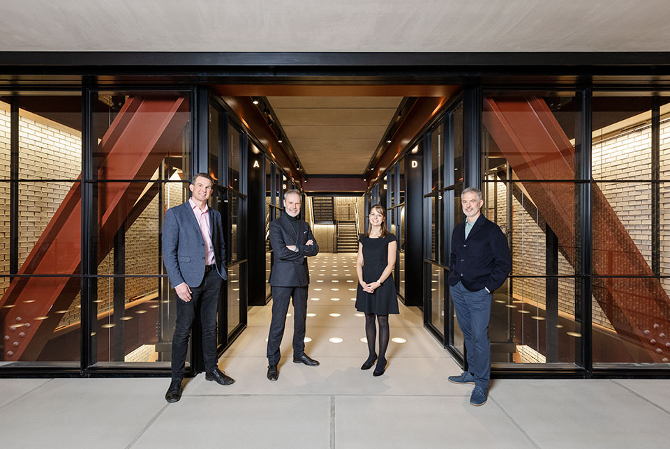 A corporate portrait of four people taken for Derwent London by Richard Boll.