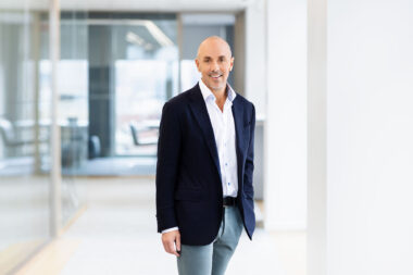 Corporate portrait of a man in a blue jacket taken by Richard Boll Photography.