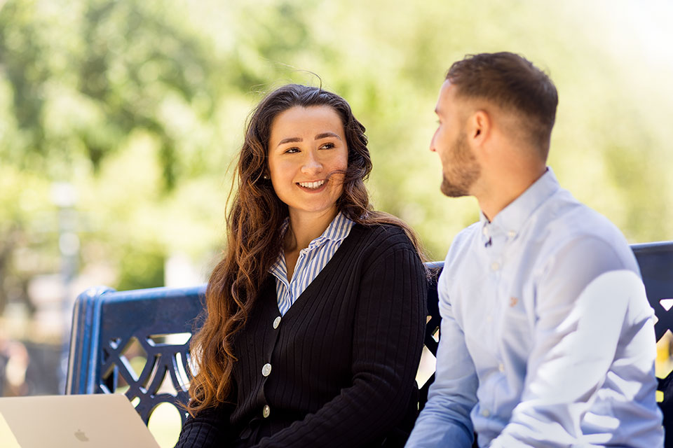 Corporate lifestyle photography of two people on a bench in Birmingham for Cavendish by Richard Boll.