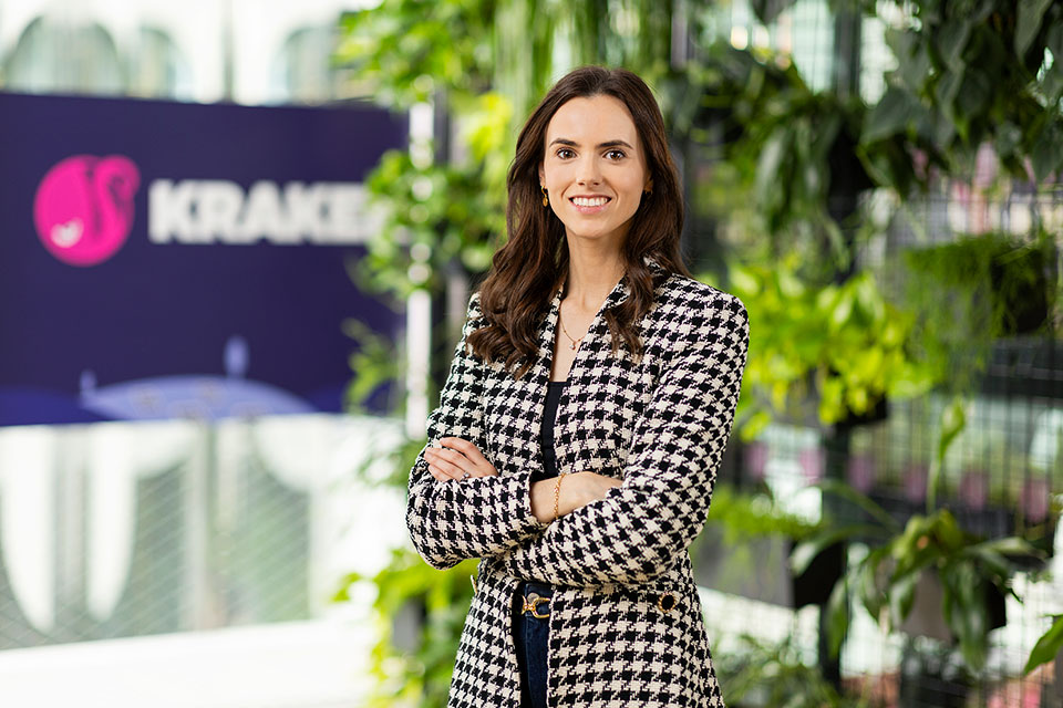 Professional headshot photography of a woman in front of a wall of plants by Richard Boll Photography, London.