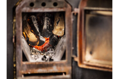 Hot burning logs used to heat a beach sauna.