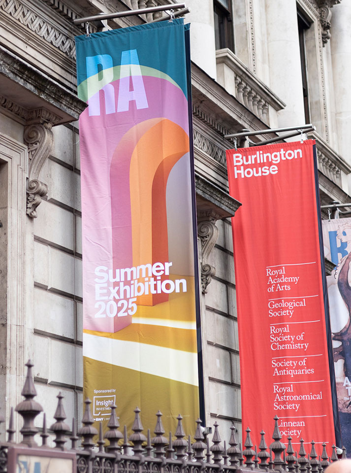 Banners advertising the Royal Academy of Arts Summer Exhibition in June 2025.