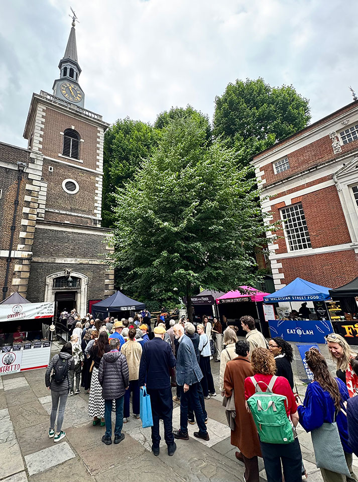 Artists waiting outside St James Church on Piccadilly during the Royal Academy of Arts Varnishing Day in June 2025.